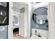 Bathroom with a sink and a view to a bedroom featuring hard wood floors at 2709 Jackson St, Indianapolis, IN 46222