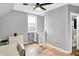 Bedroom featuring hardwood floors, a ceiling fan, a window and a small gate at 2709 Jackson St, Indianapolis, IN 46222