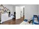 A cozy bedroom that includes toys, teddy bears, and a changing table with hardwood floor at 2709 Jackson St, Indianapolis, IN 46222