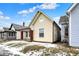 Charming yellow two-story home with brick-lined porch and front yard landscaping at 2709 Jackson St, Indianapolis, IN 46222