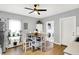 Open kitchen with a large window, a refrigerator, a dining table, and a laundry area at 2709 Jackson St, Indianapolis, IN 46222