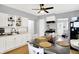 Bright kitchen featuring white cabinets, stainless steel appliances, and a dining area at 2709 Jackson St, Indianapolis, IN 46222