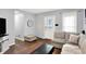 Cozy living room featuring a comfortable sofa, modern decor, and hardwood floors at 2709 Jackson St, Indianapolis, IN 46222