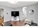 Cozy living room featuring a large TV and hardwood floors at 2709 Jackson St, Indianapolis, IN 46222
