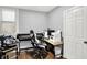 Office with desk, computer, printer, and a comfortable chair for remote work or creative pursuits at 2709 Jackson St, Indianapolis, IN 46222