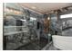 Luxurious shower with elegant tile work and modern fixtures, inside a Primary bath with soaker tub at 2828 N Illinois St, Indianapolis, IN 46208