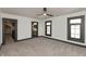 Bright bedroom features plush carpet, a ceiling fan, and an ensuite bath with modern fixtures at 2828 N Illinois St, Indianapolis, IN 46208