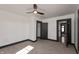 Empty bedroom with neutral carpet, white walls, and black trim, featuring a ceiling fan and closet at 2828 N Illinois St, Indianapolis, IN 46208