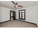 Bedroom features carpeted floor, ceiling fan, natural light from the windows, and contrasting trim at 2828 N Illinois St, Indianapolis, IN 46208