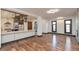 Open concept kitchen featuring stainless steel appliances, island with seating, and hardwood floors at 2828 N Illinois St, Indianapolis, IN 46208