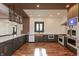 An open-concept kitchen featuring custom cabinetry and a copper farmhouse sink at 2828 N Illinois St, Indianapolis, IN 46208