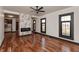 Stylish living room with hardwood floors, marble fireplace accent, and open layout to other areas of the home at 2828 N Illinois St, Indianapolis, IN 46208