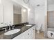 Bathroom with double sinks, black granite countertop, and tile flooring at 2829 Country Estates Dr, Indianapolis, IN 46227