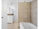 Bathroom with a bathtub, beige tile, and a single sink vanity at 2829 Country Estates Dr, Indianapolis, IN 46227