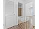 Hallway view of a full bathroom with tiled walls and a shower-tub combo at 2829 Country Estates Dr, Indianapolis, IN 46227