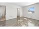 Empty bedroom with wood-look flooring and view into another room at 2829 Country Estates Dr, Indianapolis, IN 46227