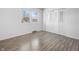 Empty bedroom with a window, closet, and wood-look flooring at 2829 Country Estates Dr, Indianapolis, IN 46227