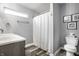 Bathroom with modern fixtures, single sink vanity, and a shower-tub combo at 3037 Knobstone Ln, Indianapolis, IN 46203