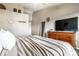 Bedroom with dresser, accent pillows, ceiling fan, and a view of outdoor space at 3037 Knobstone Ln, Indianapolis, IN 46203