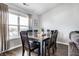 Elegant dining room featuring a large table, stylish chairs, and natural light at 3037 Knobstone Ln, Indianapolis, IN 46203