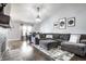 Well-lit living room with an open dining area, comfortable sofa, and stylish decor at 3037 Knobstone Ln, Indianapolis, IN 46203