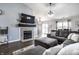 Open-concept living room showcasing a fireplace, TV, and comfortable seating area at 3037 Knobstone Ln, Indianapolis, IN 46203