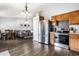 Open floor plan with dining table, stainless appliances and living room at 3037 Knobstone Ln, Indianapolis, IN 46203