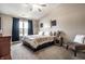 Cozy primary bedroom featuring a large window, and neutral color scheme at 3037 Knobstone Ln, Indianapolis, IN 46203