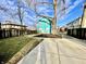 A well-maintained backyard with a concrete patio and a large grassy area at 3236 Central Ave, Indianapolis, IN 46205
