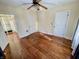 Vacant bedroom featuring hardwood floors, three doors and a glimpse of a closet at 3236 Central Ave, Indianapolis, IN 46205