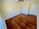 A spacious bedroom has hardwood flooring and features two entry doors and a ceiling fan at 3236 Central Ave, Indianapolis, IN 46205