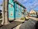 A charming two-story home with a blue exterior, showcasing its curb appeal and inviting entryway at 3236 Central Ave, Indianapolis, IN 46205