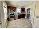 Kitchen featuring stainless steel appliances, granite countertops and dark wood cabinetry at 3236 Central Ave, Indianapolis, IN 46205