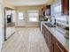 Well-lit kitchen with stainless steel appliances, granite countertops, and tile flooring at 3236 Central Ave, Indianapolis, IN 46205