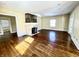 Bright living room featuring a fireplace and hardwood floors at 3236 Central Ave, Indianapolis, IN 46205