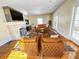 Cozy living room with fireplace, hardwood floors, and lots of seating at 3236 Central Ave, Indianapolis, IN 46205