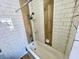 This shower has a white subway tile surround and a shower head with multiple spray settings at 3236 Central Ave, Indianapolis, IN 46205