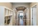 Inviting hallway showcasing archway details, wood floors, and an open view to the dining area at 3629 S Meadows Ln, New Palestine, IN 46163