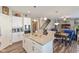 Modern kitchen with white cabinets, granite countertops, a kitchen island, and stainless steel appliances at 3629 S Meadows Ln, New Palestine, IN 46163