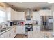 Bright kitchen with stainless steel appliances, granite countertops, and plenty of cabinet space for storage at 3629 S Meadows Ln, New Palestine, IN 46163
