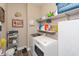 Functional laundry room with washer, dryer, shelves and storage at 3629 S Meadows Ln, New Palestine, IN 46163