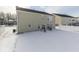 Wide backyard view with snow covering the ground, a patio area, and a white fence at 387 Legacy Blvd, Greenwood, IN 46143