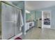 Bright bathroom with walk-in shower, vanity, and neutral paint at 387 Legacy Blvd, Greenwood, IN 46143
