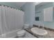 Bathroom with a shower-tub combo, toilet, and sink with countertop space at 387 Legacy Blvd, Greenwood, IN 46143