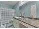 Bathroom featuring a sink with countertop, mirror, toilet, and shower-tub combination at 387 Legacy Blvd, Greenwood, IN 46143