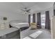 Bedroom with a neutral color scheme, ceiling fan, and natural light from the windows at 387 Legacy Blvd, Greenwood, IN 46143
