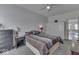 Bedroom with a queen bed, ceiling fan, neutral carpet and view of a connecting room at 387 Legacy Blvd, Greenwood, IN 46143