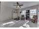 Bright bedroom with a ceiling fan, two chairs, and two windows for natural light at 387 Legacy Blvd, Greenwood, IN 46143