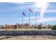 A community entrance sign reading 'University Park' under a bright sky with colorful flags at 387 Legacy Blvd, Greenwood, IN 46143