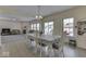 Inviting dining area with views to the living room and a sliding door to the backyard at 387 Legacy Blvd, Greenwood, IN 46143